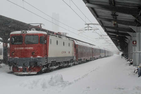 Bucharest, Romania, 17 January 2016: A train is seen in Gara de Nord main railway station, after a heavy snowfall.のeditorial素材