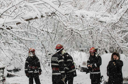 Bucharest, Romania, 17 January 2016: Firemen intervene to clear a street after a heavy snowfall in Bucharest.のeditorial素材