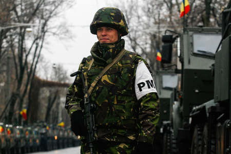 BUCHAREST, ROMANIA - DECEMBER 1, 2010: Military are taking part to a military parade on National Day of Romania. More than 3,000 soldiers and personnel from security agencies take part in the massive parades on National Day of Romania.のeditorial素材