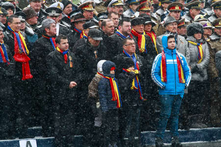 BUCHAREST, ROMANIA - DECEMBER 1, 2014: Officials are taking part to a military parade on National Day of Romania. More than 3,000 soldiers and personnel from security agencies take part in the massive parades on National Day of Romania.のeditorial素材