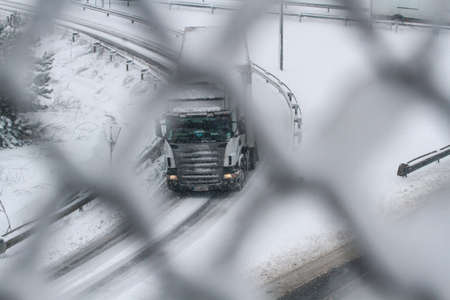 Highway 2, Romania, December 29, 2014: A truck is passing on the highway A2, the main commercial route which connects Bucharest to the Black Sea's port, Constanta.のeditorial素材