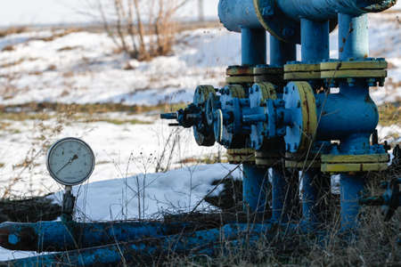 Bucharest, Romania, December 30, 2012: Slate gas or oil equipment with many pipelines, valves, connectors, panel and motors are seen on a field outskirts Bucharest.のeditorial素材