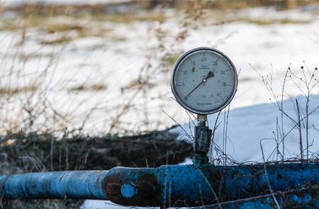 Bucharest, Romania, December 30, 2012: Slate gas or oil equipment with many pipelines, valves, connectors, panel and motors are seen on a field outskirts Bucharest.のeditorial素材