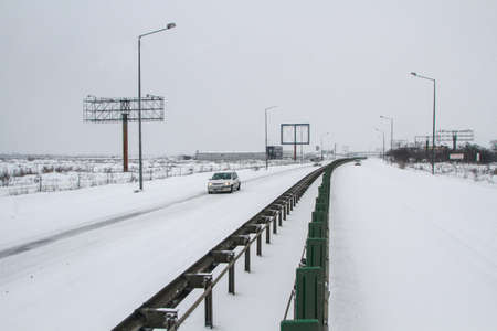 Highway 2, Romania, December 29, 2014: Cars are passing on the highway A2, the main commercial route which connects Bucharest to the Black Sea's port, Constanta.のeditorial素材