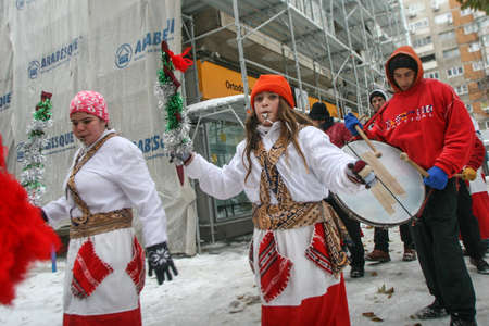 Bucharest, Romania, January 11, 2017: A group of carol singers dressed in bear fur are performing in a neighborhood of Bucharest.のeditorial素材