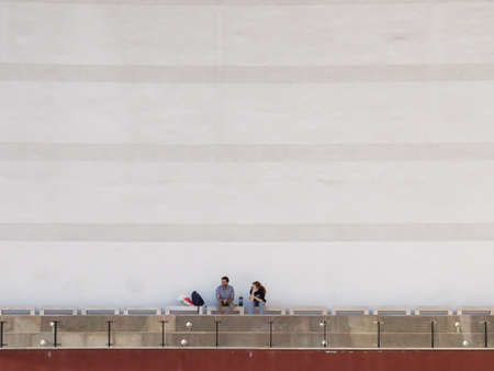 Bucharest, Romania, March 30, 2016: Two men are smoking in an outdoor smoking area of the National Theater in Bucharest.のeditorial素材