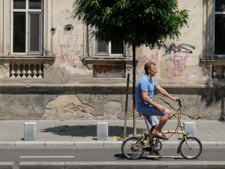 Bucharest, Romania, July 24, 2016: A man is riding a bicycle on a designed track for bicycles, in the center of  Bucharest.のeditorial素材