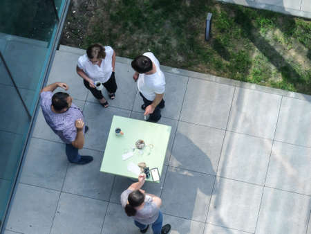 Bucharest, Romania, May 30, 2016: People are smoking and drinking coffee in an outdoor smoking area of an office building in Bucharest.のeditorial素材