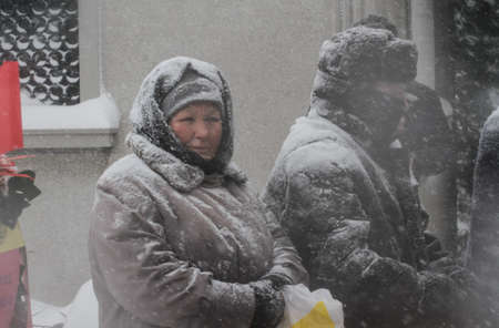 Bucharest, Romania, January 26, 2014: People gathered at the grave of Romania's late communist dictator Nicolae Ceausescu, to commemorate his birthday. Year after year Romania's nostalgic Communists gather to mourn Ceausescu, who was executed on Christmasのeditorial素材