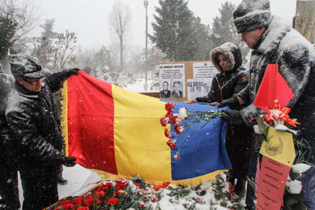 Bucharest, Romania, January 26, 2014: People gathered at the grave of Romania's late communist dictator Nicolae Ceausescu, to commemorate his birthday. Year after year Romania's nostalgic Communists gather to mourn Ceausescu, who was executed on Christmasのeditorial素材