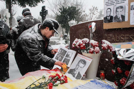 Bucharest, Romania, January 26, 2014: People gathered at the grave of Romania's late communist dictator Nicolae Ceausescu, to commemorate his birthday. Year after year Romania's nostalgic Communists gather to mourn Ceausescu, who was executed on Christmasのeditorial素材