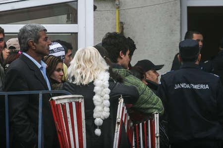 Cretesti, Ilfov County, Romania, December 6, 2009: People standing in a queue to vote in Cretesti, Ilfov County.のeditorial素材