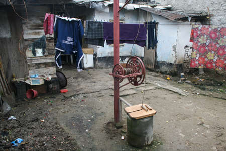 Bucharest, Romania, December 5, 2009: A pit is seen in an improvised settlement in the historical part of Bucharest.のeditorial素材