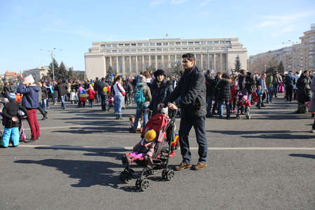Bucharest, Romania - February 04, 2017:  Parents with kids protest in front of Romanian Government by playing and drawing on asphalt against the new more permissive laws for corruption.のeditorial素材