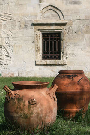 Heresti, Romania, April 5, 2009: Old clay pots near to a church wall.のeditorial素材