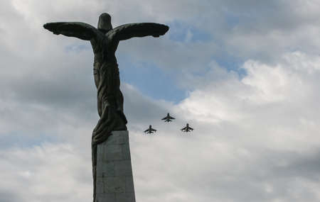 Bucharest, Romania, July 20, 2009: Military airplanes flying above the Aviators statue during Aviation Day parade in Bucharest.のeditorial素材