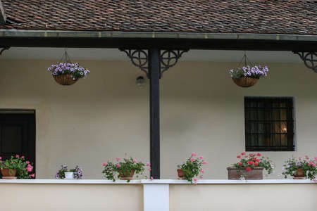 Bran, Romania, July 4, 2009: The porch with flowers of Vama museum near Bran castle in Transylvania, Romania.のeditorial素材