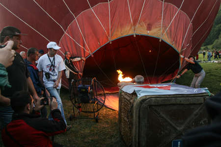 Campul Cetatii, Mures county, Romania, September 27, 2009: People participate at the Hot Air Balloons Festival in Campul Cetatii, Romania.のeditorial素材
