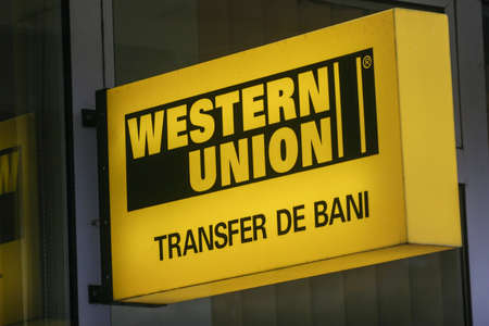 Bucharest, Romania, November 15, 2009: Western union money transfer neon advertisement.