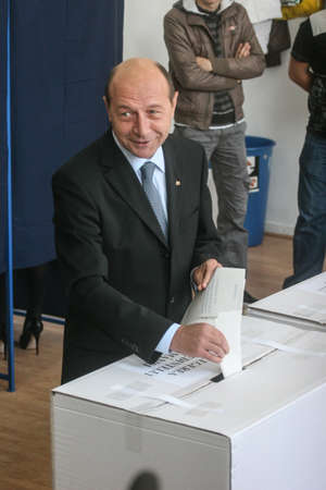 Bucharest, Romania, November 22, 2009: Politician Traian Basescu votes for the presidential elections, in a polling station in Bucharest.のeditorial素材
