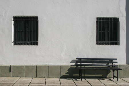 Sinaia, Romania, October 9, 2009: An exterior wall with windows and a bench of the Memorial House George Enescu in Sinaia.のeditorial素材