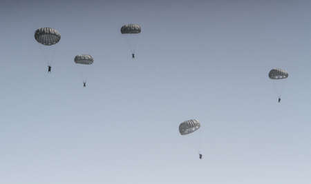 BUZAU, ROMANIA, June 18, 2016: Skydivings flying with parachutes in the BOBAS air show, on the Boboc aerodrome in Buzau.のeditorial素材