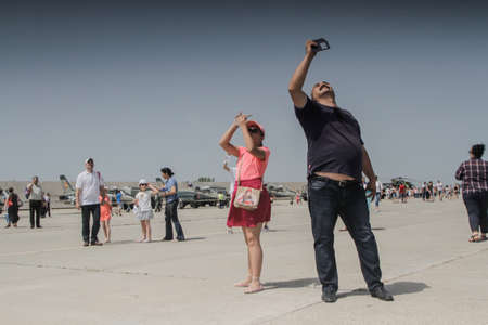 BUZAU, ROMANIA, June 18, 2016: People participate in the BOBAS air show, on the Boboc aerodrome in...