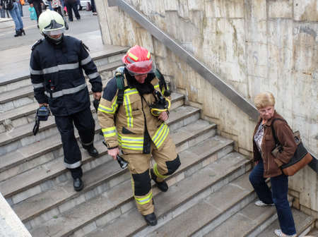 BUCHAREST, ROMANIA, June 14, 2016: Fire fighters taking control of a fire inside Victory subway...