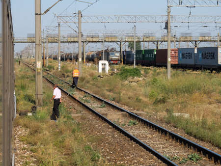BUCHAREST, ROMANIA, July 15, 2016: A passengers train on railroad outskirts Bucharest.のeditorial素材