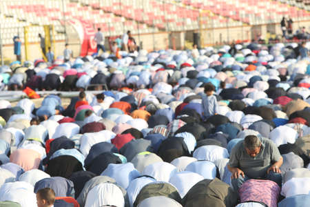 BUCHAREST, ROMANIA - June 25, 2017: Muslims celebrating Eid al-Fitr which marks the end of the month of Ramadan, on Dinamo Stadium.のeditorial素材