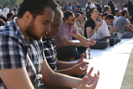 BUCHAREST, ROMANIA - June 25, 2017: Muslims celebrating Eid al-Fitr which marks the end of the month of Ramadan, on Dinamo Stadium.のeditorial素材