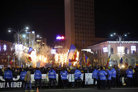Bucharest, Romania - December 10, 2017: Gendarmerie holds a line during a protest rally in front of Romanian government against the decision of changing justice laws.のeditorial素材