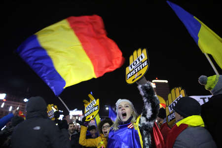 Bucharest, Romania - December 10, 2017: A woman shouts slogans during a protest rally in front of...