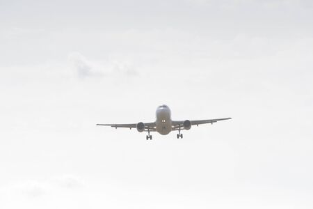 BUCHAREST, ROMANIA - August 15, 2017: Airplane in the cloudy sky.のeditorial素材
