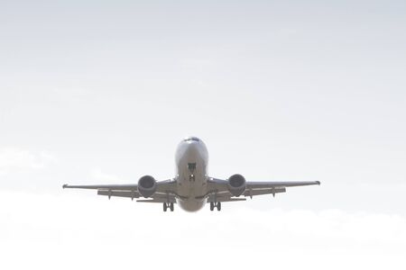 BUCHAREST, ROMANIA - August 15, 2017: Airplane in the cloudy sky.のeditorial素材