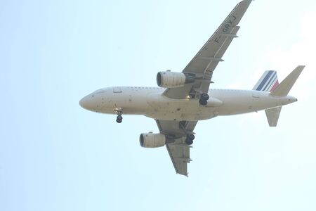 BUCHAREST, ROMANIA - August 15, 2017: Airplane in the cloudy sky.のeditorial素材