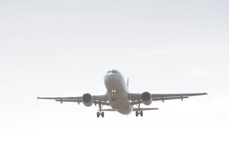 BUCHAREST, ROMANIA - August 15, 2017: Airplane in the cloudy sky.のeditorial素材
