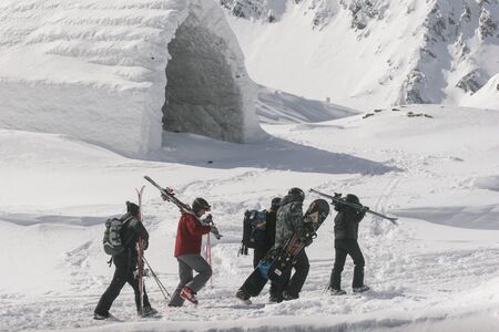 SIBIU, ROMANIA - March 13, 2010: Group of skiers and snowboarders at the Balea lake, Fagaras mountains.のeditorial素材