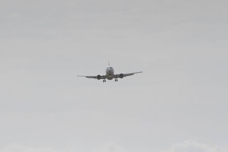 BUCHAREST, ROMANIA - August 15, 2017: Airplane in the cloudy sky.のeditorial素材