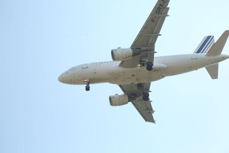 BUCHAREST, ROMANIA - August 15, 2017: Airplane in the cloudy sky.のeditorial素材