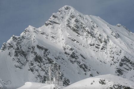 SIBIU, ROMANIA - March 13, 2010: Telecomunications station covered in snow, Fagaras mountains.のeditorial素材