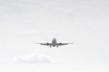 BUCHAREST, ROMANIA - August 15, 2017: Airplane in the cloudy sky.のeditorial素材