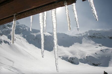 SIBIU, ROMANIA - March 13, 2010: Icicles hang from the roof in Faragas mountains.のeditorial素材