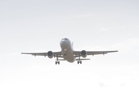 BUCHAREST, ROMANIA - August 15, 2017: Airplane in the cloudy sky.のeditorial素材