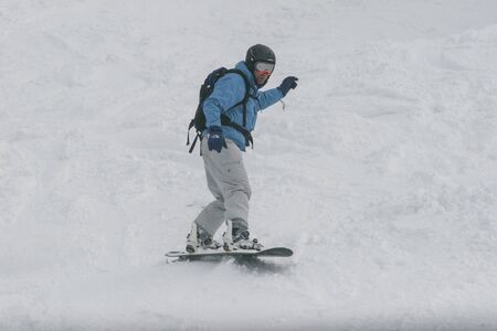 SIBIU, ROMANIA - March 13, 2010: Male snowboarder in the Fagaras mountains.のeditorial素材