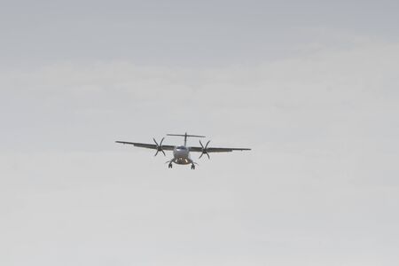 BUCHAREST, ROMANIA - August 15, 2017: Airplane in the cloudy sky.のeditorial素材