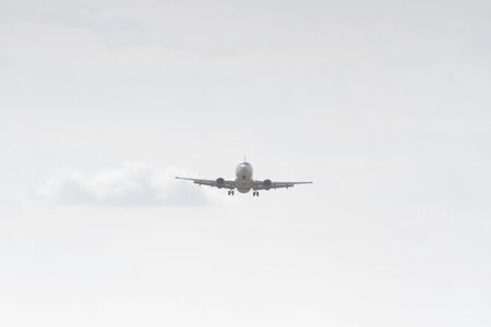 BUCHAREST, ROMANIA - August 15, 2017: Airplane in the cloudy sky.のeditorial素材