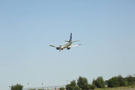 BUCHAREST, ROMANIA - August 15, 2017: Airplane in the cloudy sky.のeditorial素材
