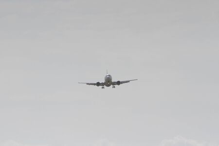 BUCHAREST, ROMANIA - August 15, 2017: Airplane in the cloudy sky.のeditorial素材