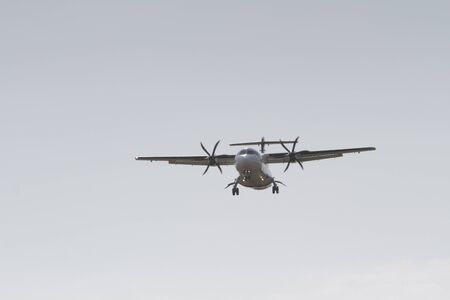 BUCHAREST, ROMANIA - August 15, 2017: Airplane in the cloudy sky.のeditorial素材